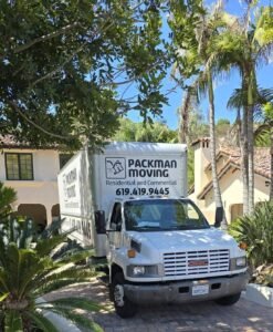Packman Moving team wrapping furniture before transport